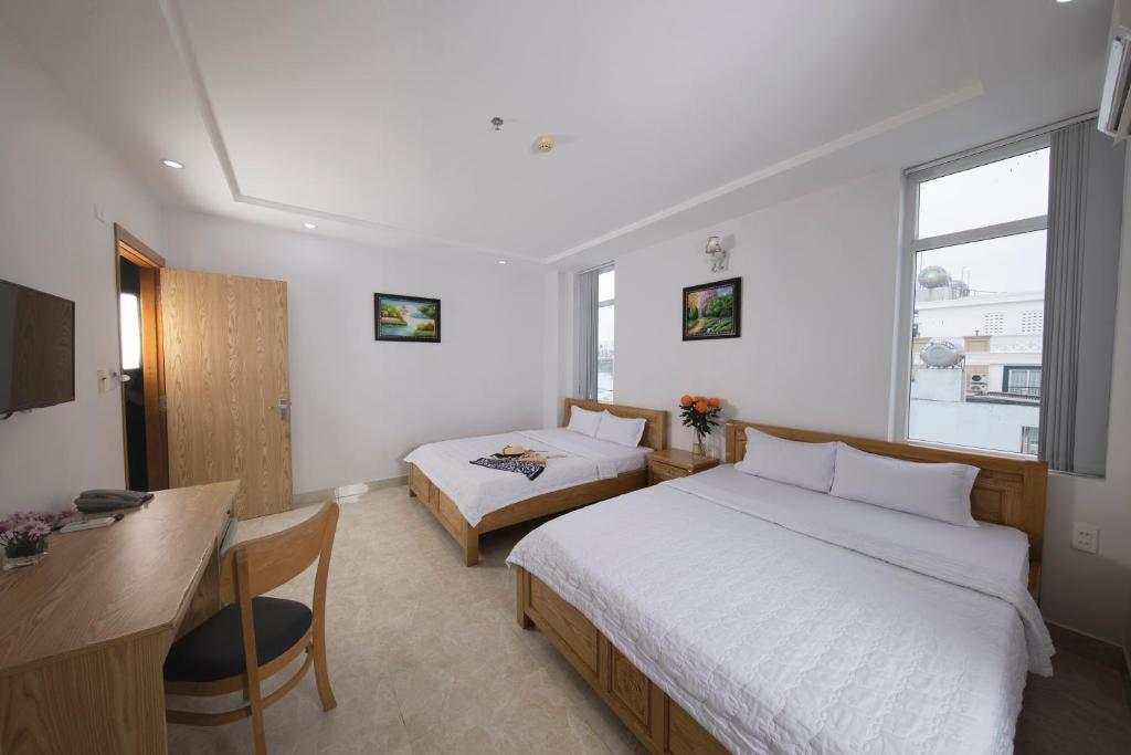 Postel nebo postele na pokoji v ubytování Oceanic Hotel Vung Tau