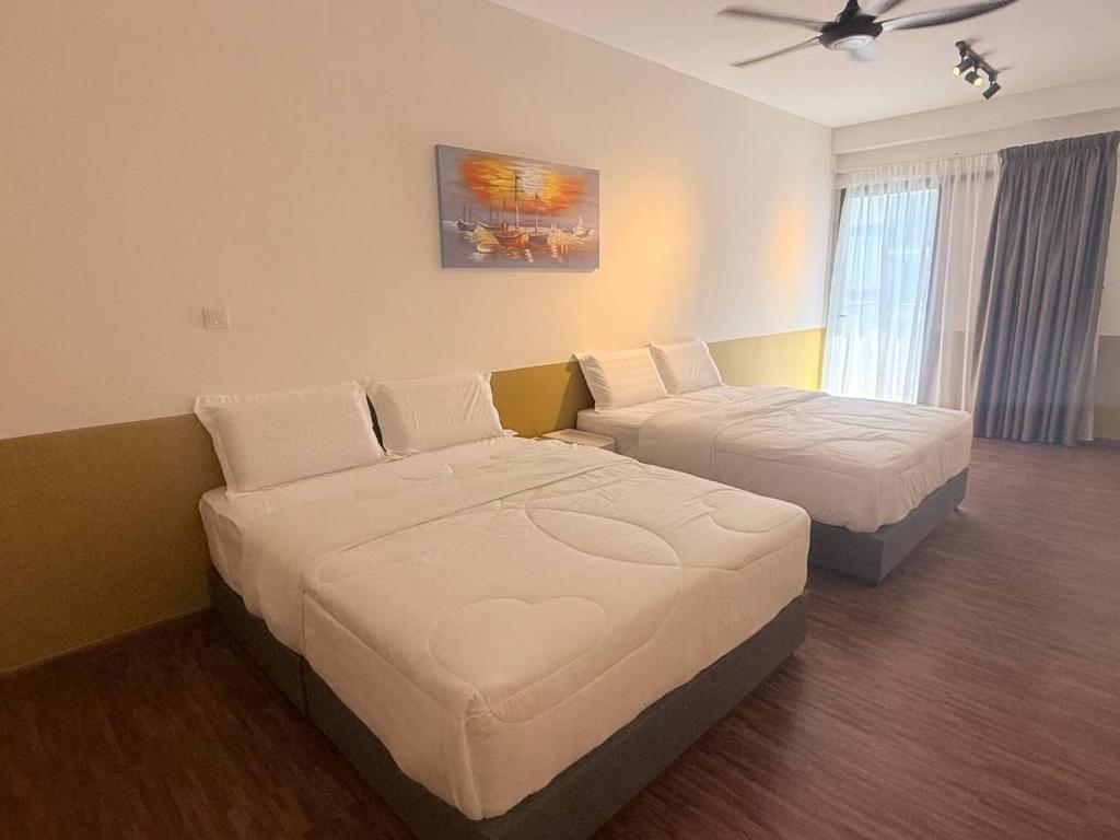 En eller flere senge i et værelse på K Avenue by Rilekbah