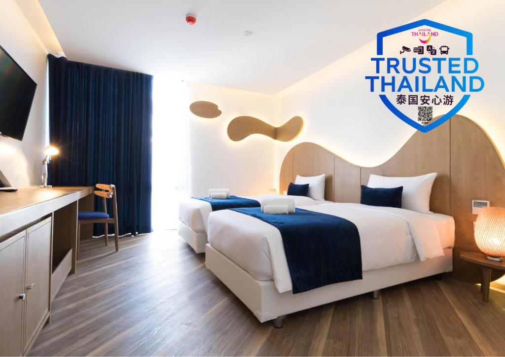 Postel nebo postele na pokoji v ubytování Klub Hotel Bangkok