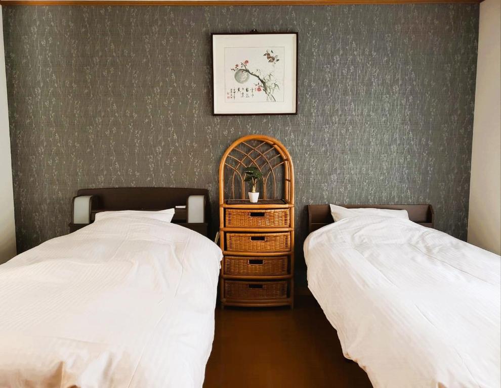 Ένα ή περισσότερα κρεβάτια σε δωμάτιο στο 竹の宿