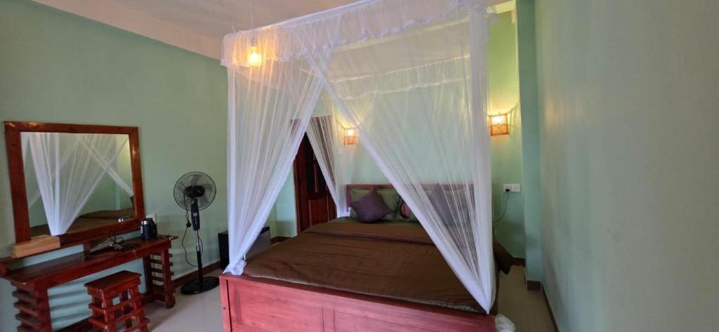 Ένα ή περισσότερα κρεβάτια σε δωμάτιο στο Zen Garden Palace