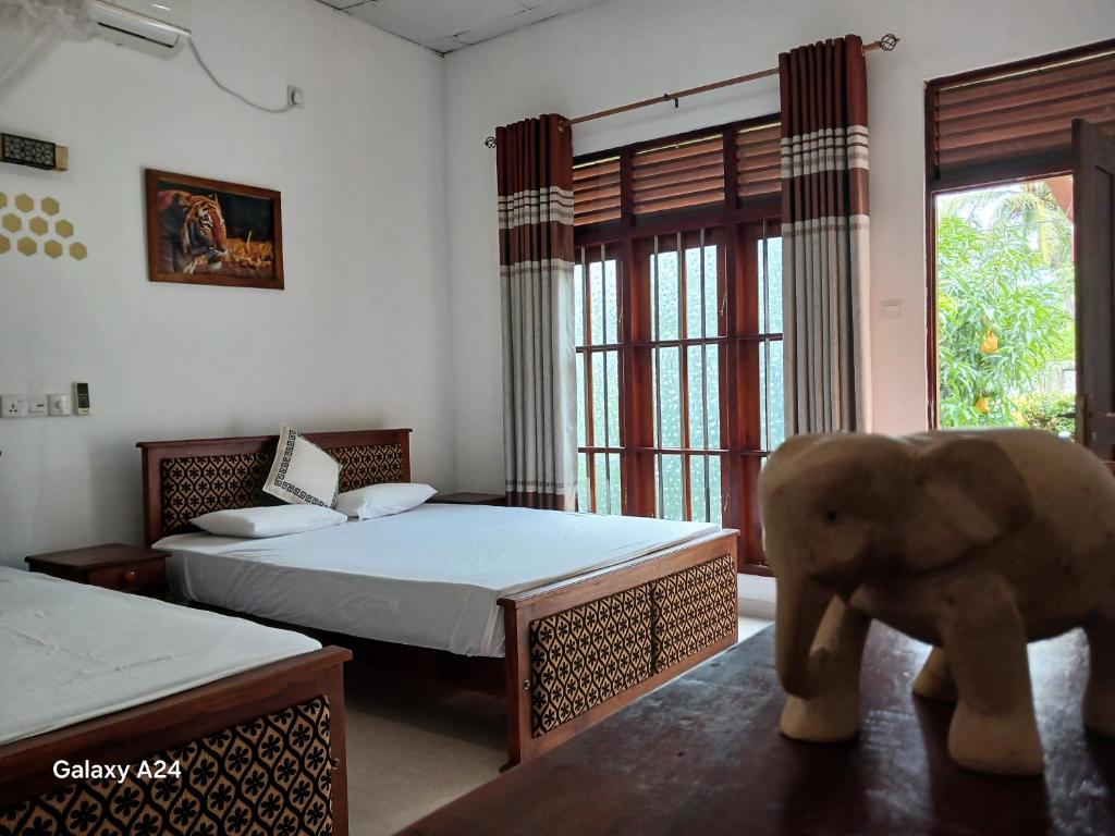 Ένα ή περισσότερα κρεβάτια σε δωμάτιο στο The elephant house