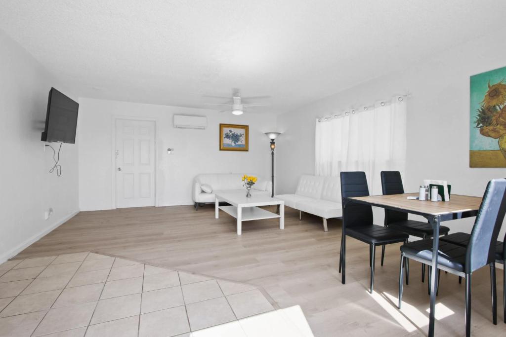 a living room with a table and a couch at Charming House Free RV Parking in Upland