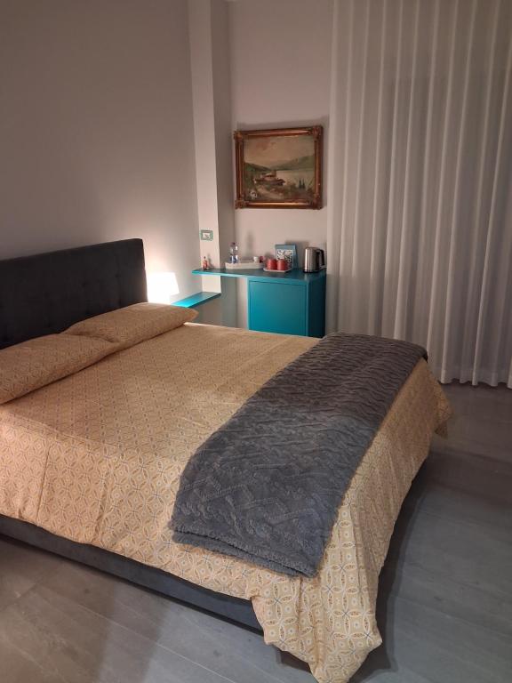 En eller flere senge i et værelse på Bellavista Trani Rooms