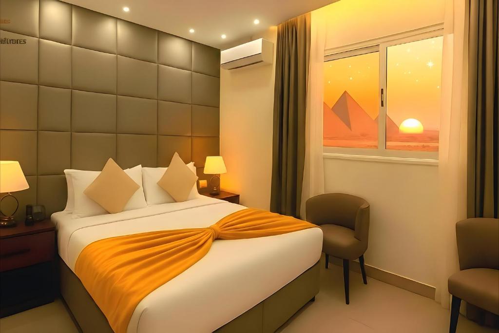 Ένα ή περισσότερα κρεβάτια σε δωμάτιο στο Pyramids Guest House View Hotel