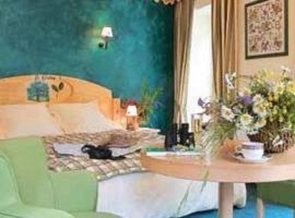 Posezení v ubytování Hôtel Le Bois Joli