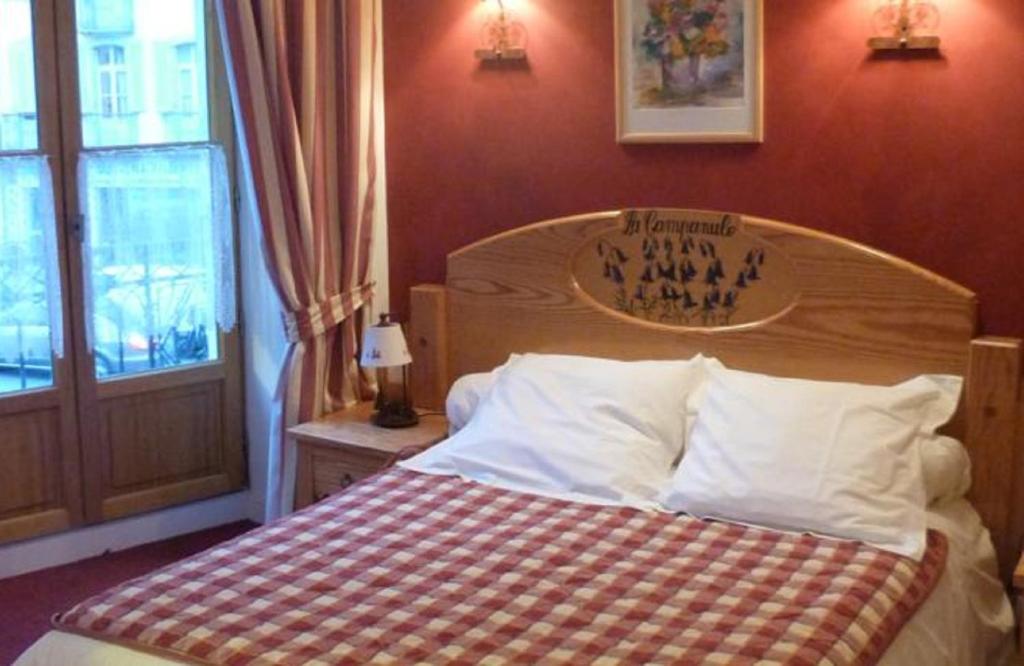 Postel nebo postele na pokoji v ubytování Hôtel Le Bois Joli