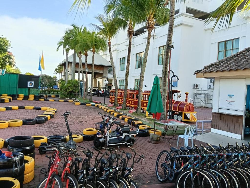 a group of bikes parked in front of a building at Grand Pool Villa Luxury Resort Port Dickson in Port Dickson