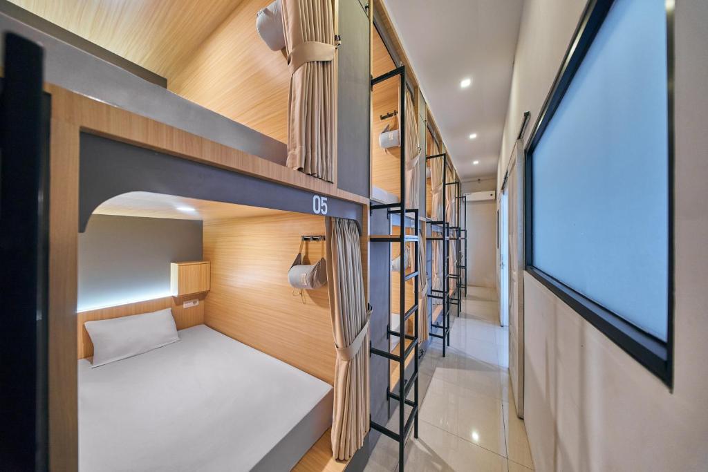 Postel nebo postele na pokoji v ubytování Sky Sleepbox