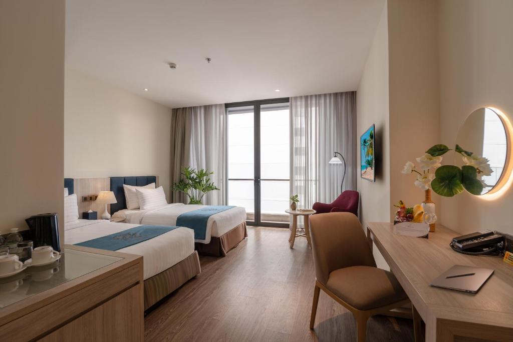 Ένα ή περισσότερα κρεβάτια σε δωμάτιο στο The Art Nest Hotel Nha Trang