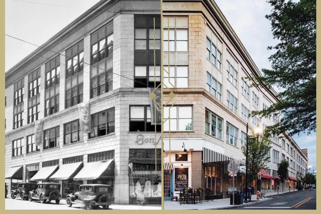 a black and white photo of a building on a street at Haywood Park Hotel, an Ascend Collection Hotel in Asheville