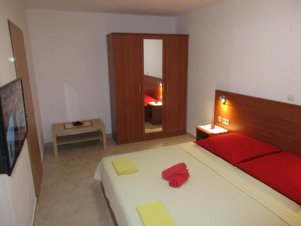 Postel nebo postele na pokoji v ubytování Apartmani Smiljanic