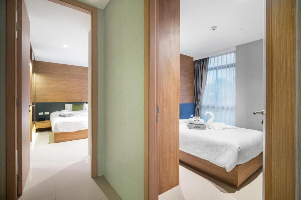 Postel nebo postele na pokoji v ubytování Stylish Beachfront 2BR Flat