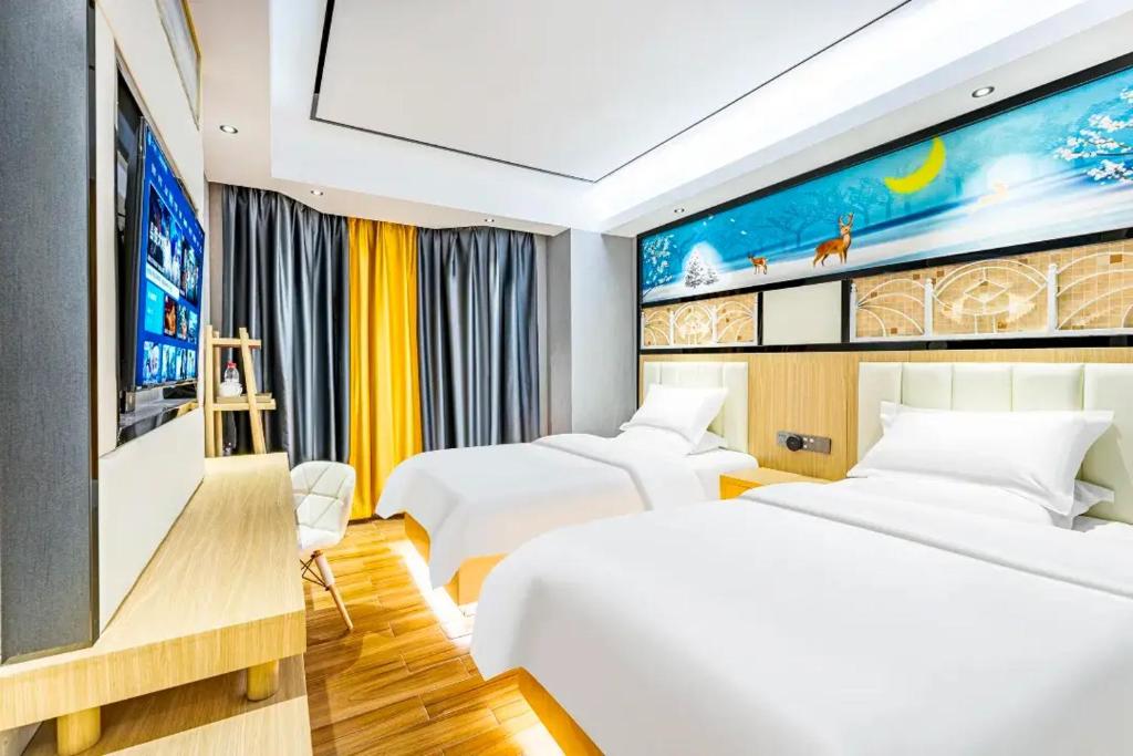 Ένα ή περισσότερα κρεβάτια σε δωμάτιο στο Star Dream Hotel