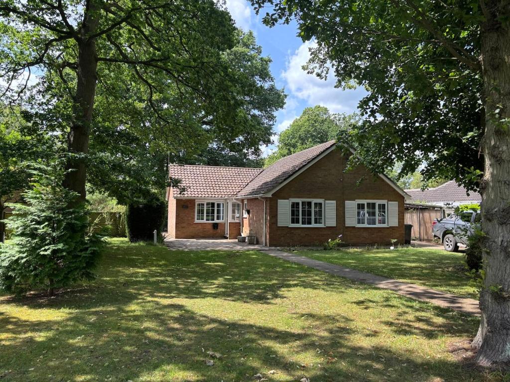 a house in a yard with a tree at Birch View, Woodhall Spa in Woodhall Spa