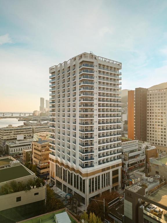 an aerial view of a tall white building at New CZ Nampo Hotel in Busan