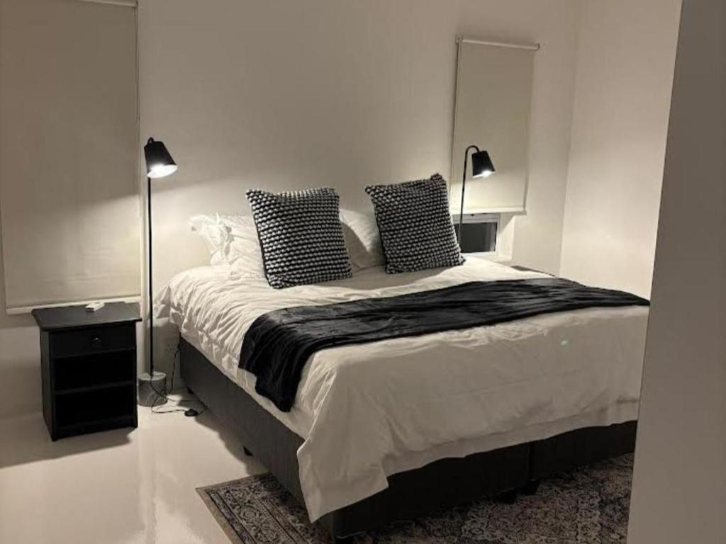 En eller flere senge i et værelse på Town House