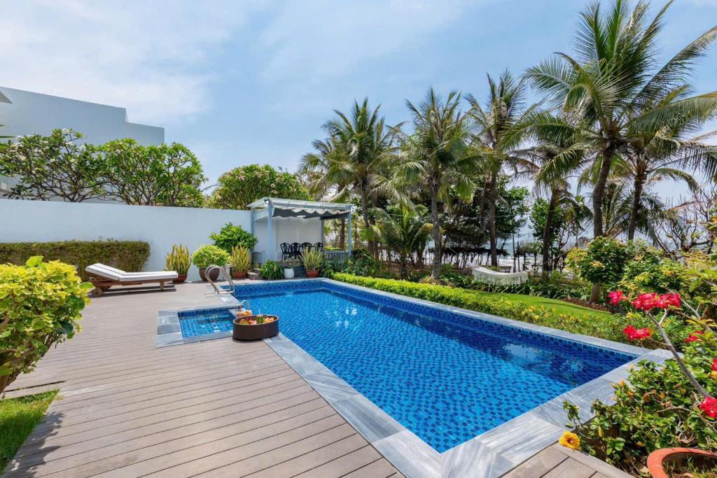 a swimming pool in the backyard of a villa at Villa D3 Private - In Great Location Front Of The Sea in Vung Tau