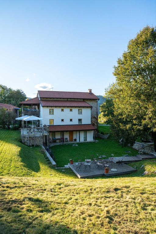 an aerial view of a large house in a field at Rest And Ride in Robidišče