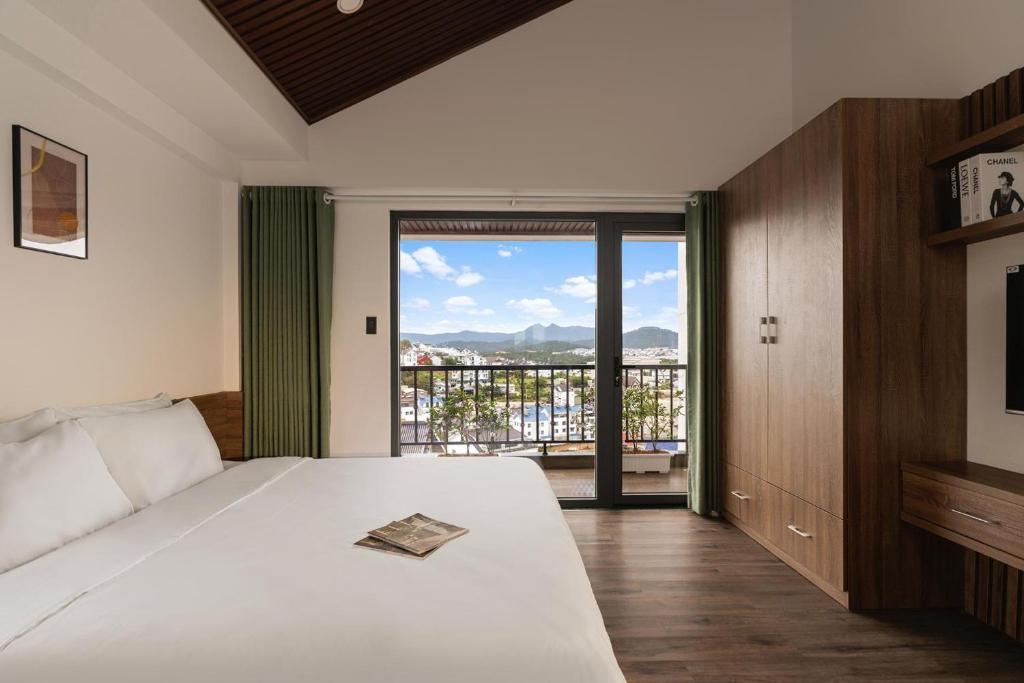 Ένα ή περισσότερα κρεβάτια σε δωμάτιο στο La Forest Villa