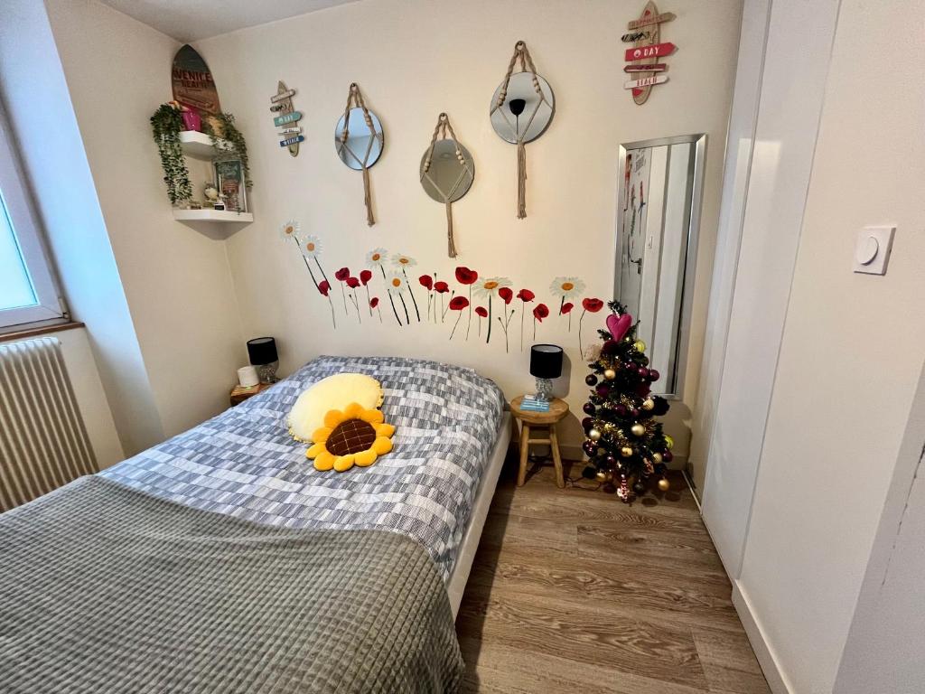 Ένα ή περισσότερα κρεβάτια σε δωμάτιο στο Le Mini Nid