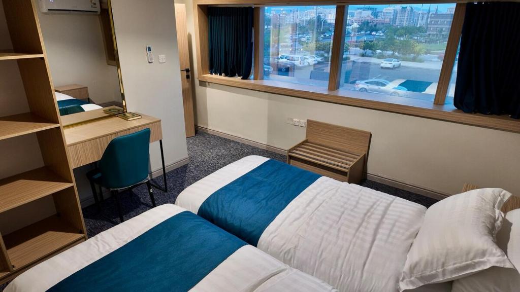 En eller flere senge i et værelse på Jabira