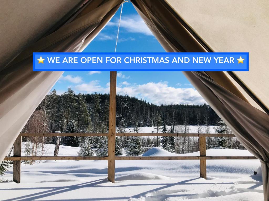 a sign that says we are open for christmas and new year at Romantic night in a dome tent lake view in Bjuråker