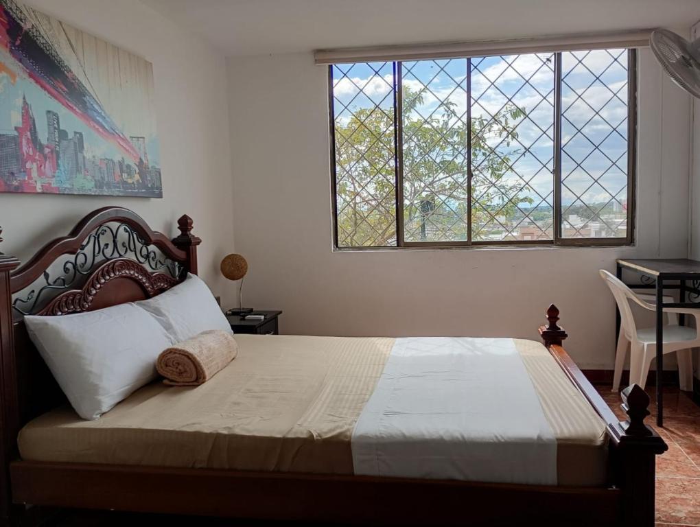 Ένα ή περισσότερα κρεβάτια σε δωμάτιο στο Hotel Iam Armenia Quindio