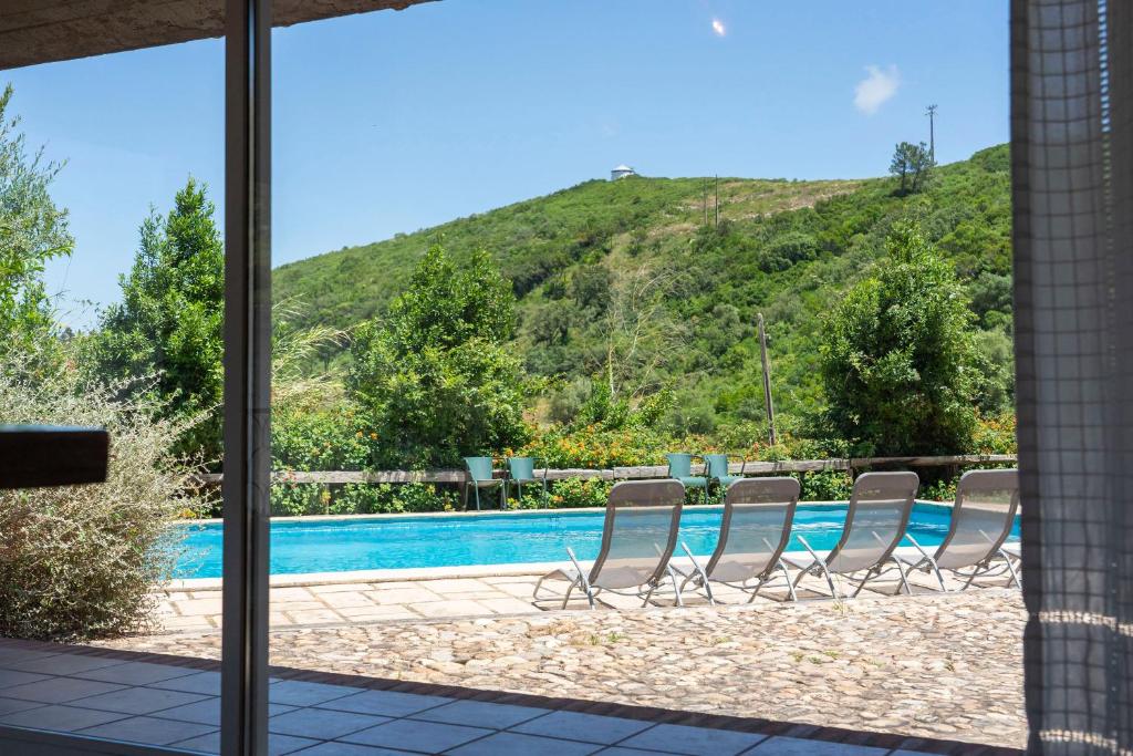 a view of a swimming pool from the house at Casa d'Aldeia in Rio Maior