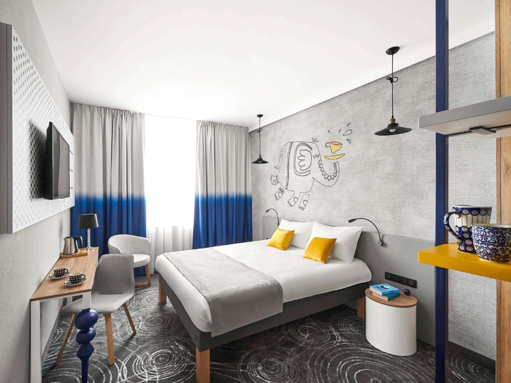 Postel nebo postele na pokoji v ubytování ibis styles Bolesławiec