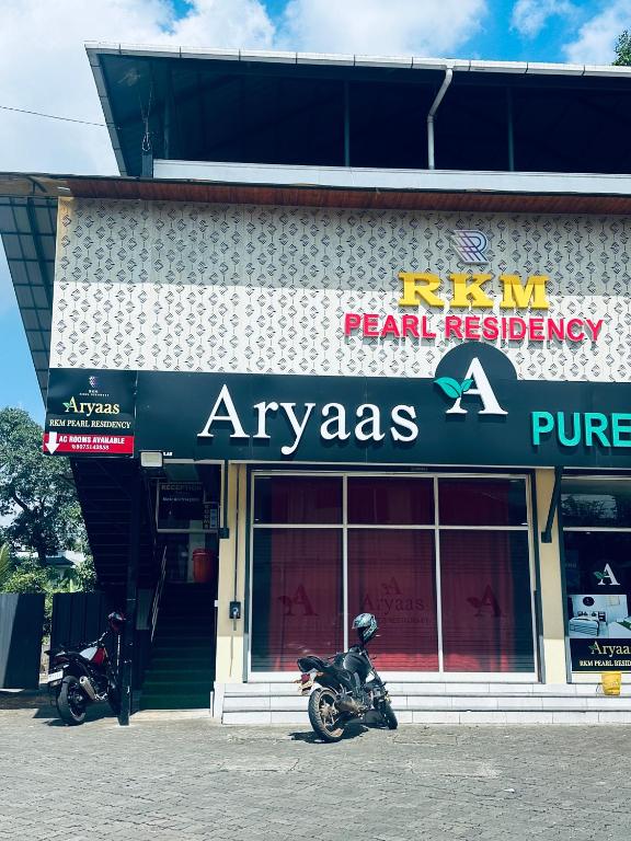 two motorcycles parked in front of a store at RKM Pearl in Cochin