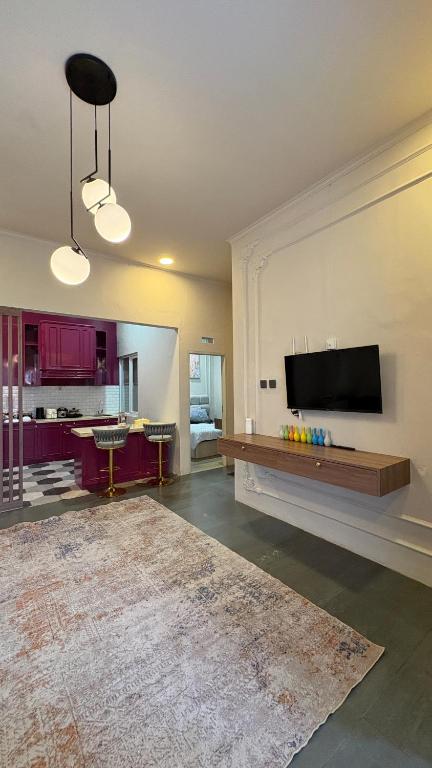 a large living room with a flat screen tv at ADS House Padalarang - Guesthouse Aesthetic in Padalarang