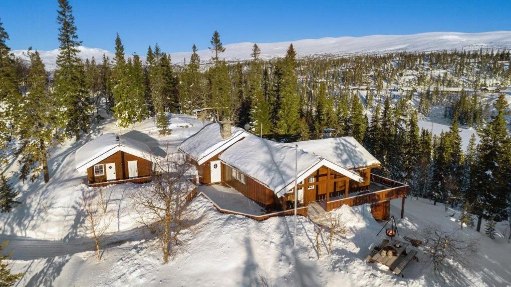 an aerial view of a house in the snow at Family Cabin With Stunning Views At Sjusjøen in Eggedal