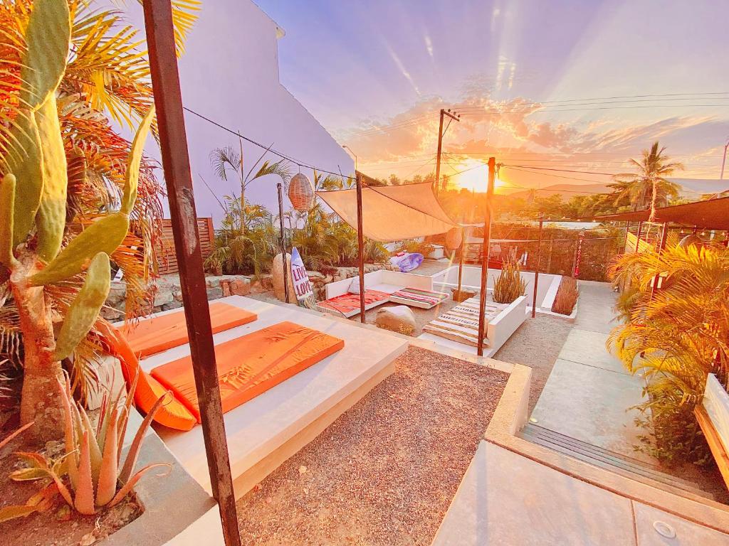 Ένα ή περισσότερα κρεβάτια σε δωμάτιο στο Perro Surfero Hotel Boutique - Todos Santos, BCS