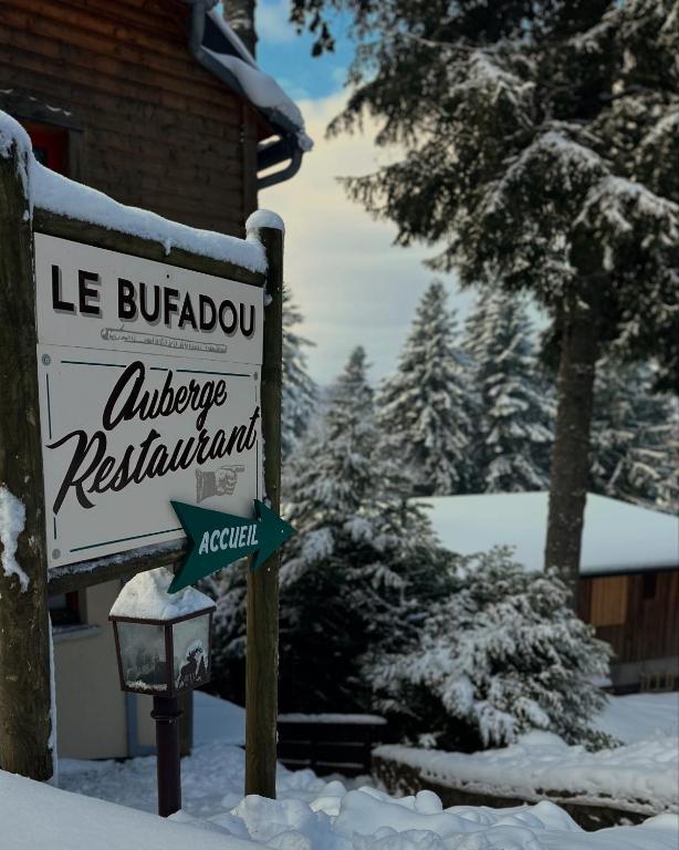 a sign for a lodge in the snow at LE BUFADOU in Laveissière