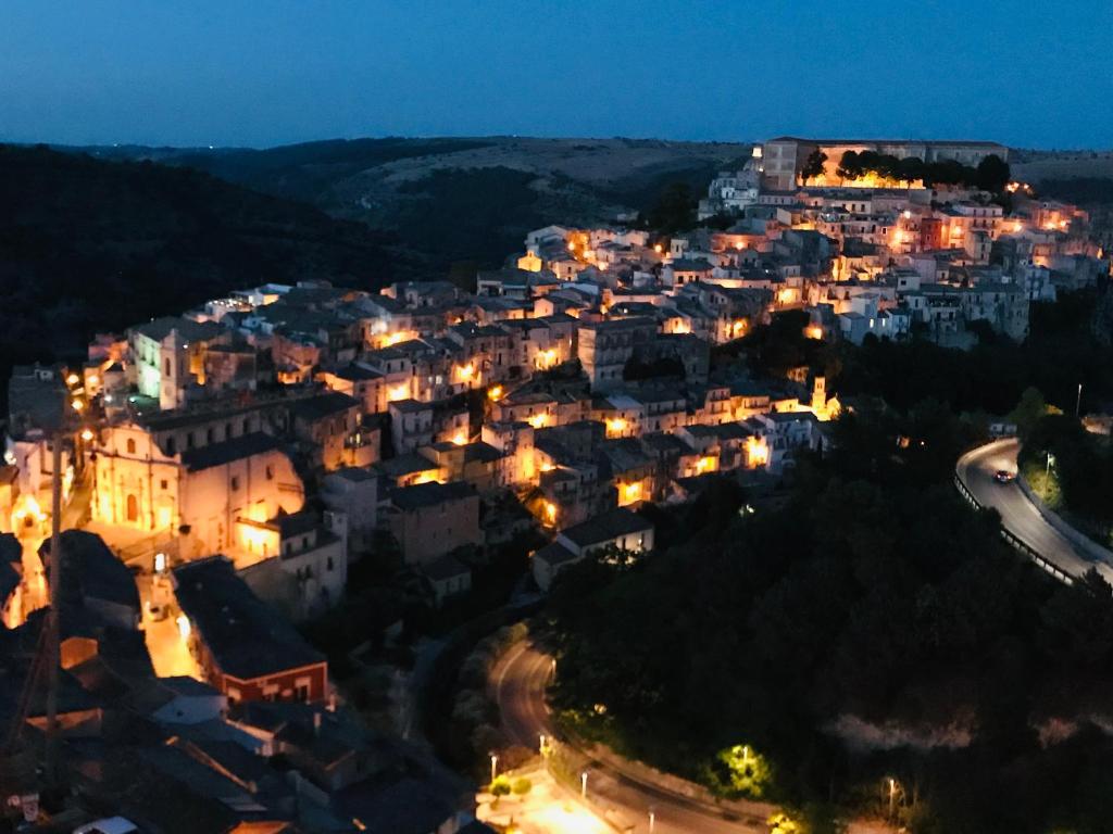 a city lit up at night with lights at Accommodates 5 people between Ibla and Ragusa in Ragusa