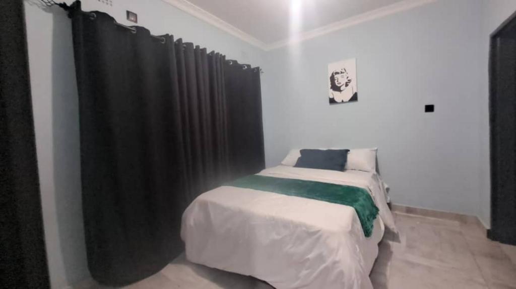 Ένα ή περισσότερα κρεβάτια σε δωμάτιο στο Nomad's Nest