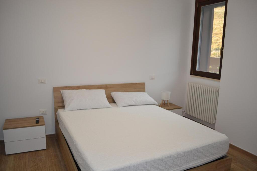 Giường trong phòng chung tại Nido Gran Sasso