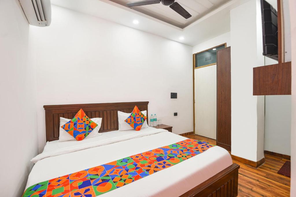 Ένα ή περισσότερα κρεβάτια σε δωμάτιο στο FabHotel The Dream Inn