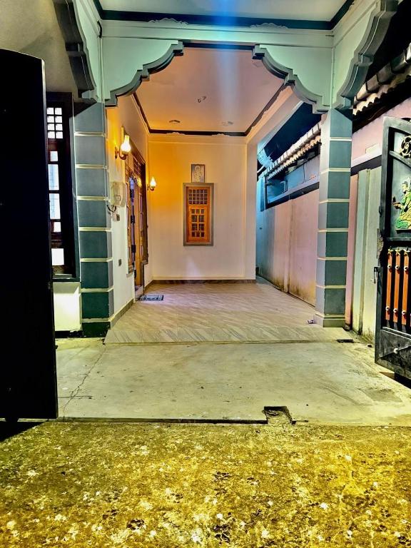 an empty hallway of a building with a door at J Rest in in Trincomalee