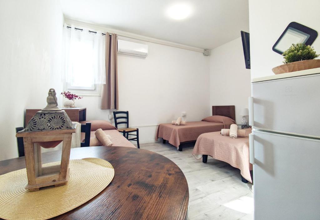 Postel nebo postele na pokoji v ubytování Castelnuovo Rooms