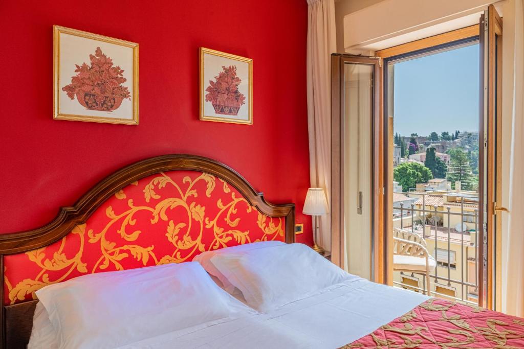 Postel nebo postele na pokoji v ubytování Hotel Isabella