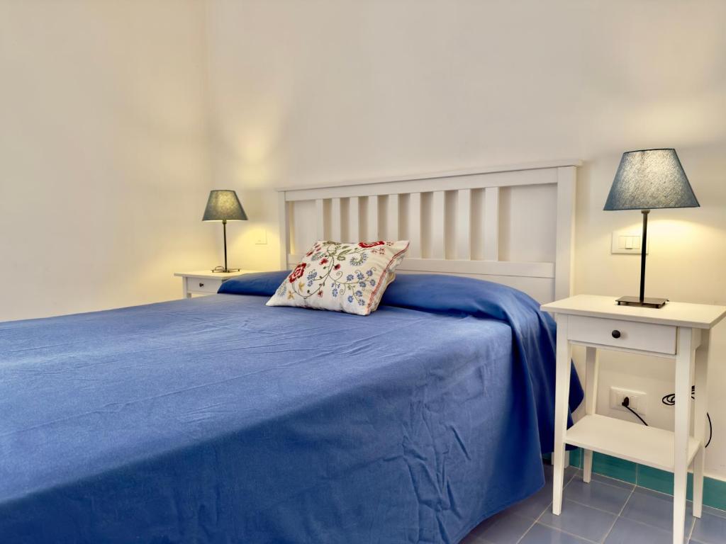 Giường trong phòng chung tại Casa di Rosa - 500m from the beach