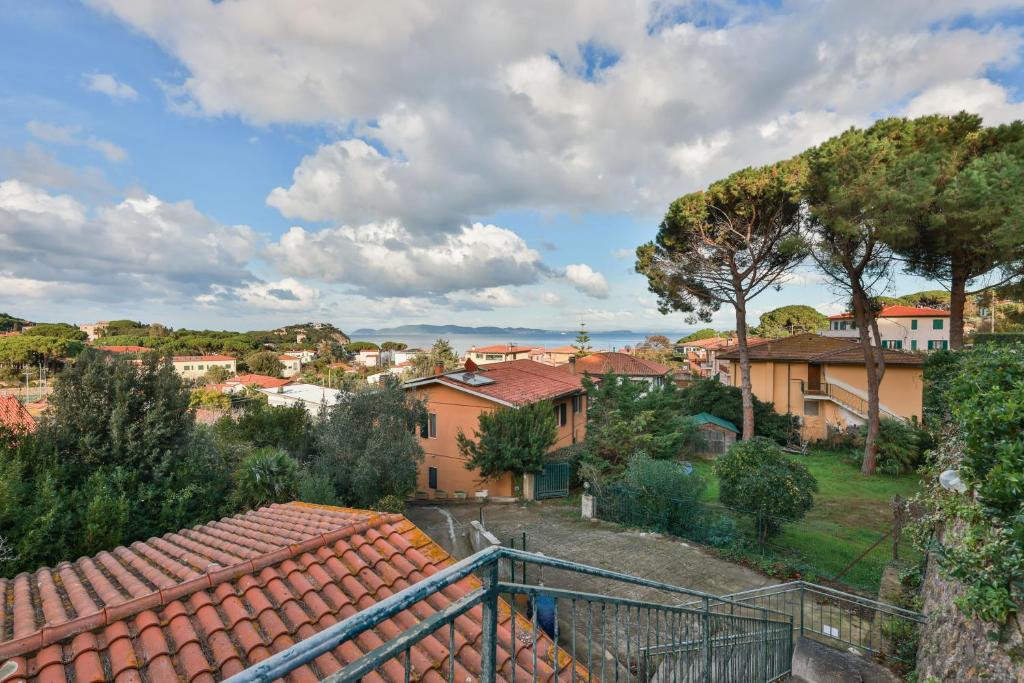 a view of a town with houses and trees at Il Cavo Suites - Elba Affitti in Cavo