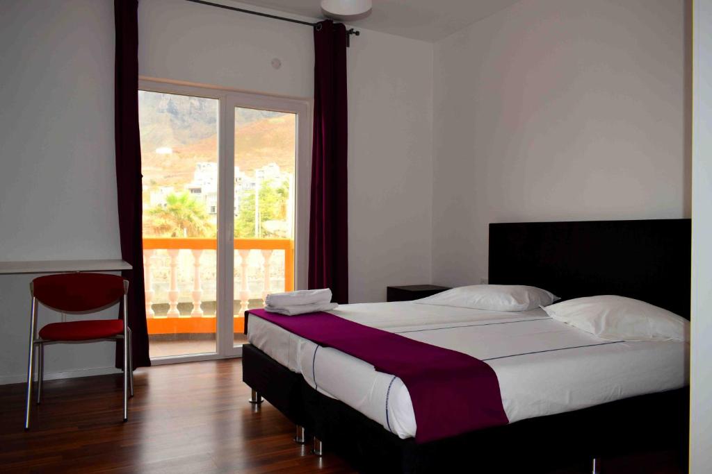 Postel nebo postele na pokoji v ubytování Hotel Miranda & Miranda