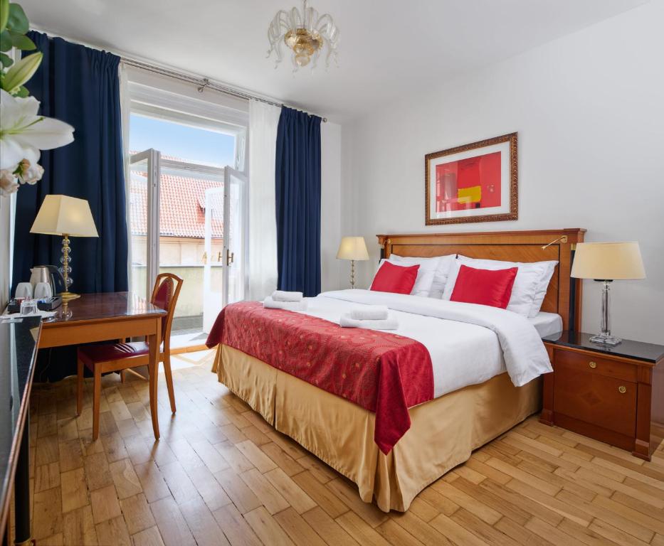 Ліжко або ліжка в номері Hotel Leon D´Oro