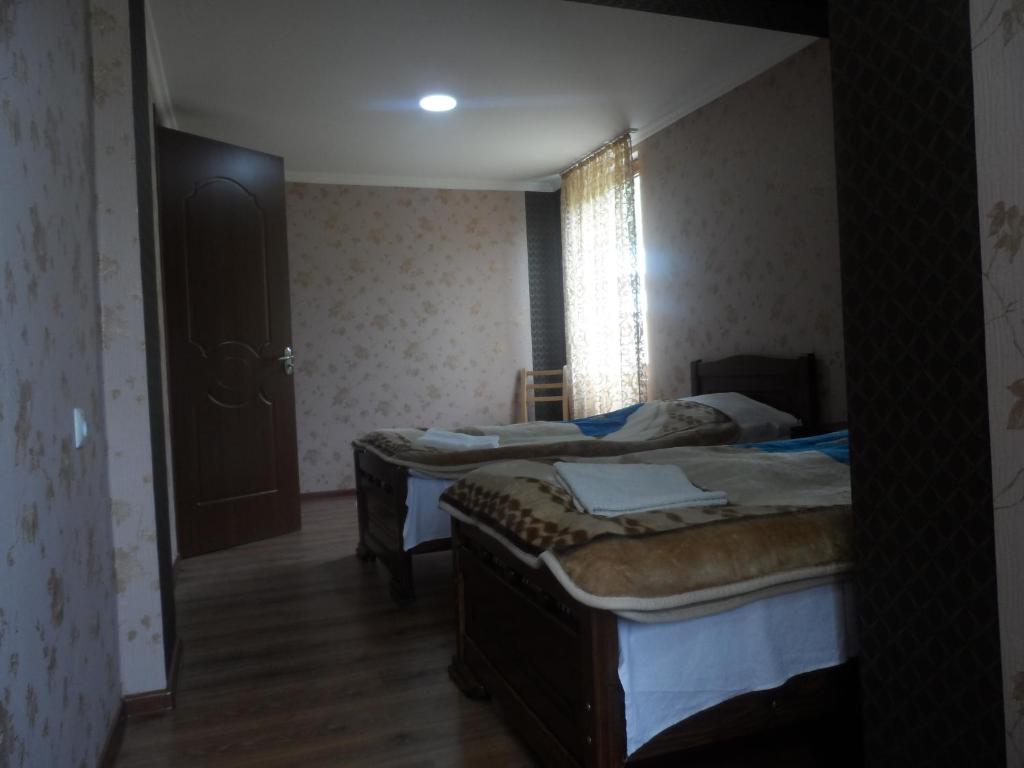 Postel nebo postele na pokoji v ubytování Hotel Tekla