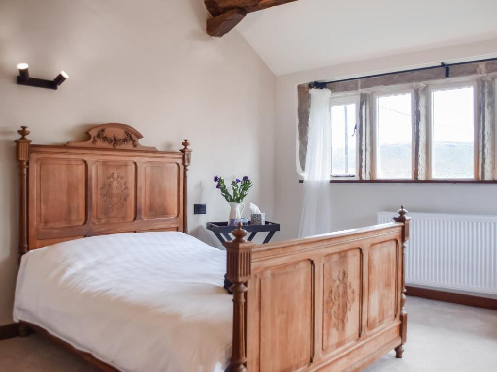 Ένα ή περισσότερα κρεβάτια σε δωμάτιο στο Cosy Cottage