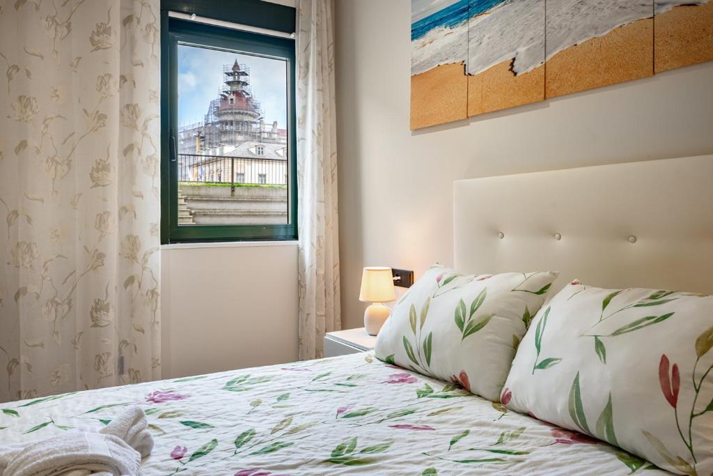 Postel nebo postele na pokoji v ubytování Apartamentos Marta