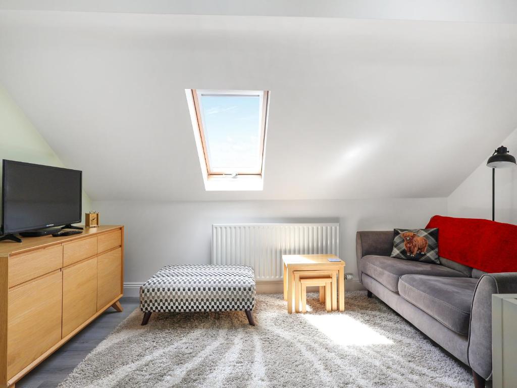 TV a/nebo společenská místnost v ubytování Four Oaks